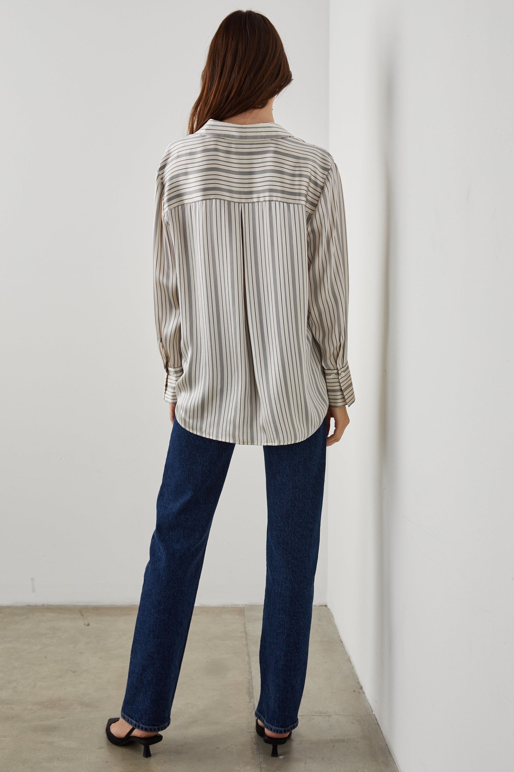 Dorian Long-Sleeve Button Up in Providence Stripe Colorway, Thin Black and Brown Vertical Stripes on Cream  - Back View Featured on Model