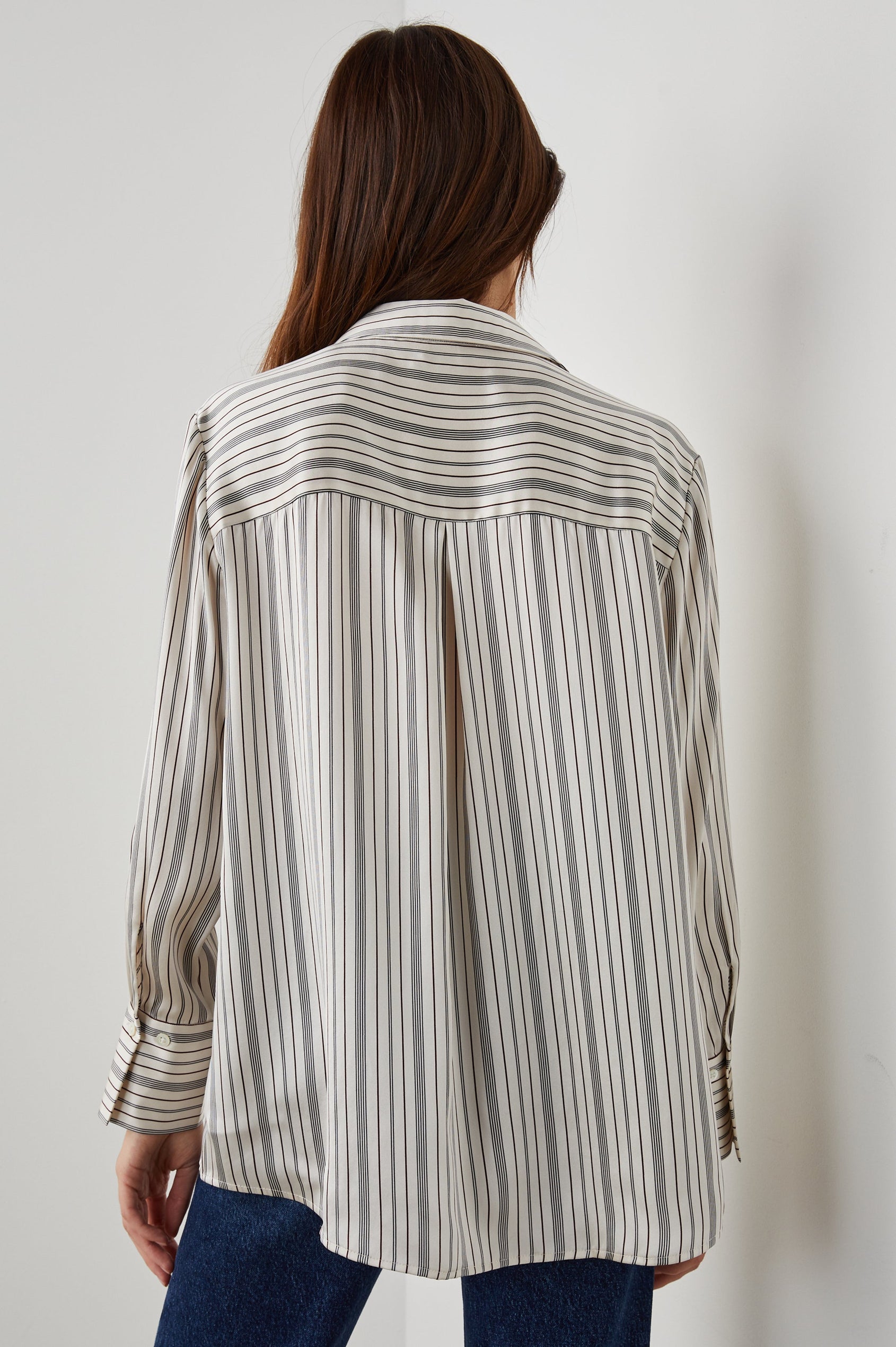 Dorian Long-Sleeve Button Up in Providence Stripe Colorway, Thin Black and Brown Vertical Stripes on Cream  - Back View Featured on Model