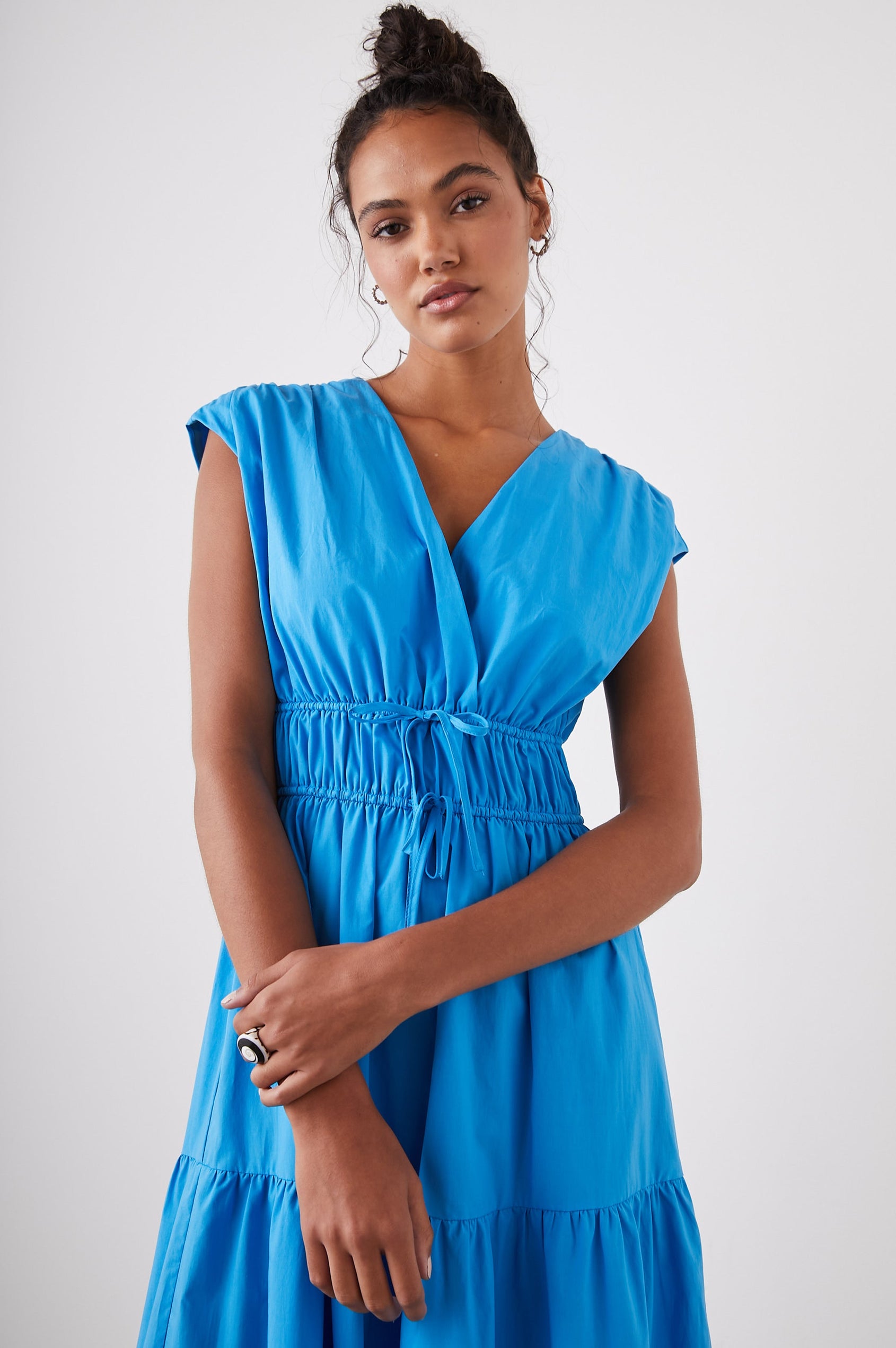 Lucia Midi Dress with Cap Sleeves, a Crossover V neckline, an Elastic Waist with Ties, and a Tiered Skirt in Pacific Colorway - Front View Featured on Model