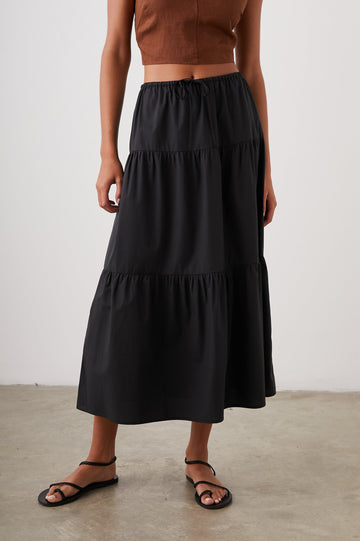 Mary Tiered Midi Skirt with a Drawstring Waist in Black Colorway - Front View Featured on Model