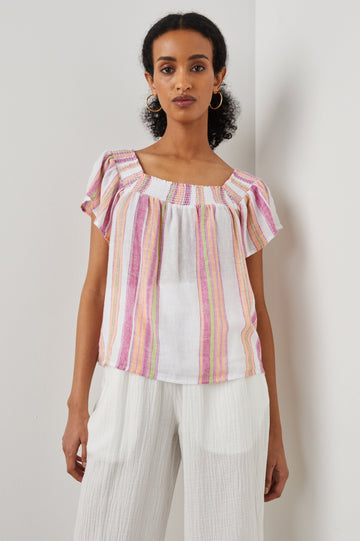 Sonora Short Sleeve Top with a Scoop Neckline and Shirring at the Neckline in Hibiscus Stripe Colorway, Vertical Stripes in Green, Orange, Pink and White - Front View Featured on Model 