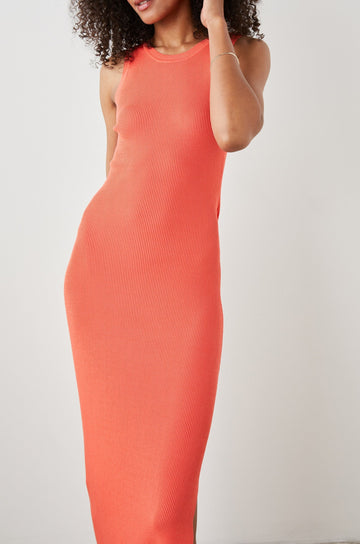 Syd Ribbed, Sleeveless Midi Dress with Wide Shoulder Straps, a Side Slit, and a Cutout that Spans the Lower Back in Black Colorway - Front Full Body View Featured on Model  