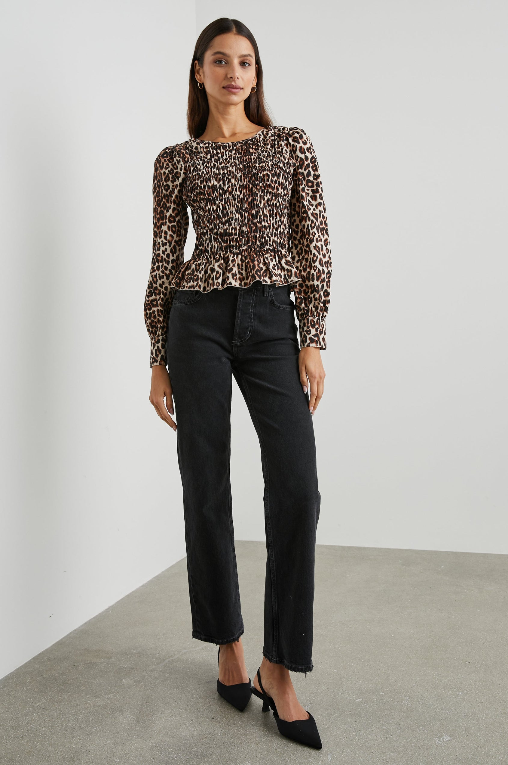 Tari Long-Sleeve Top with Shirring Across the Bodice, a Ruffled Hem, a Scoop Neck and Button Cuffs in Nala Colorway, Brown and Black Spots on White - Front Full Body View Featured on Model 