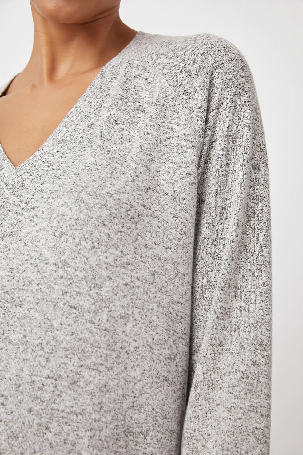 Thalia Long-Sleeve T-Shirt with a V Neck and a High Low Hem in Melange Grey Colorway - Front View Featured on Model 