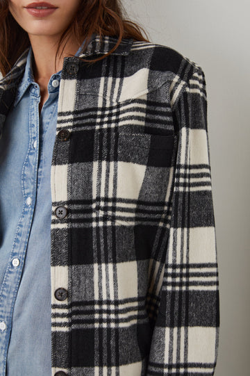 Tripp Shirt Jacket, Long-Sleeve Button Up with a Chest Patch Pocket in Oyster Black Colorway, a Plaid in Cream and Black - Front View Featured on Model 