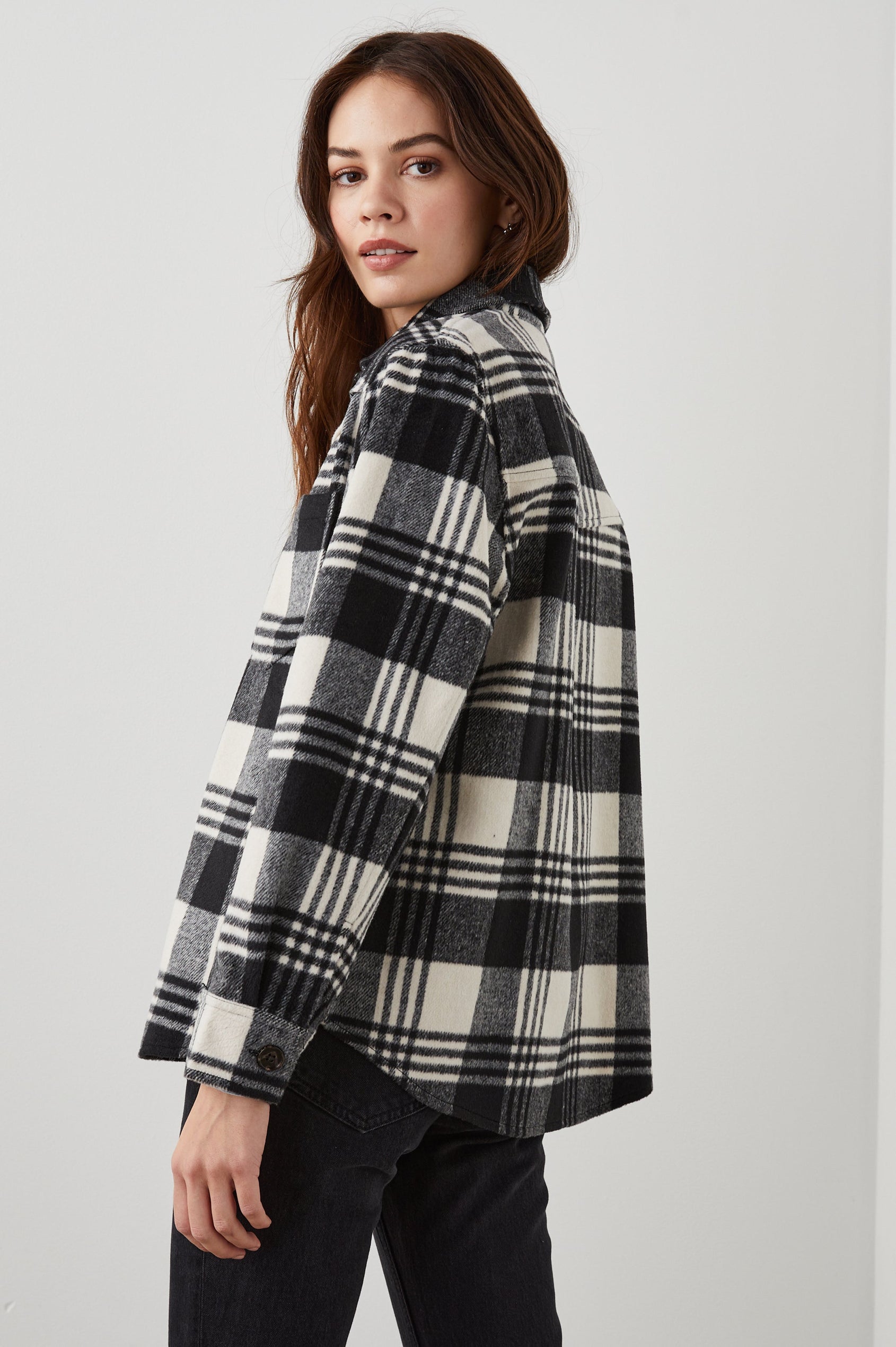 Tripp Shirt Jacket, Long-Sleeve Button Up with a Chest Patch Pocket in Oyster Black Colorway, a Plaid in Cream and Black - Side View Featured on Model 